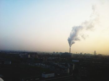 Cityscape against cloudy sky