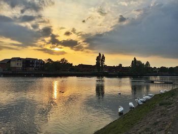 Scenic view of lake at sunset