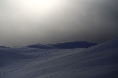 Scenic view of mountains against sky during winter