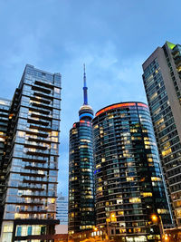 Low angle view of modern buildings against sky at night