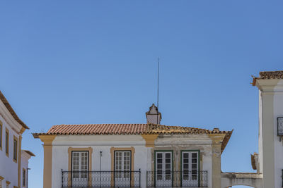 Low angle view of building against blue sky