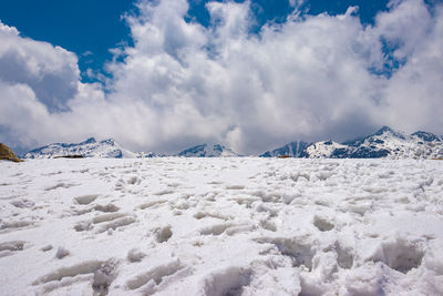 Scenic view of snowcapped mountains against sky