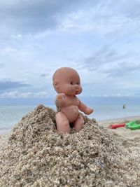Full length of cute baby boy on beach
