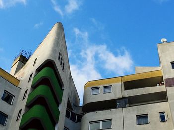 Low angle view of building against blue sky