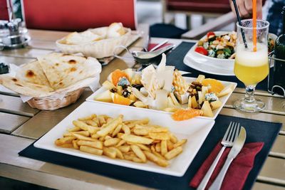 High angle view of food and drink served on table in restaurant