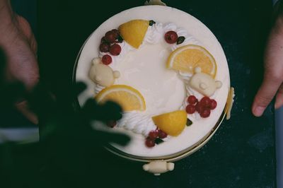 Close-up of hand holding ice cream