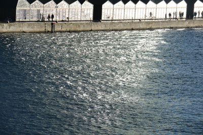 Scenic view of sea against building