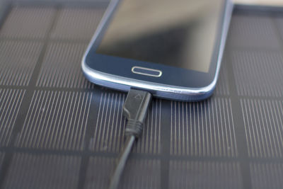 High angle view of smart phone on table