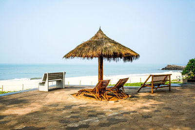 Lifeguard hut on beach against clear sky