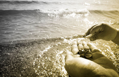 Close-up of man surfing in sea