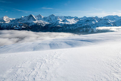 Snow covered mountains against sky