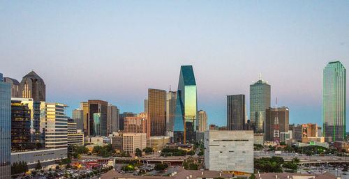 Modern buildings against sky in city