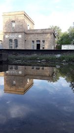 Reflection of old building in lake