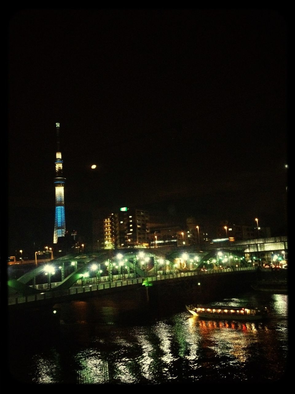 night, illuminated, architecture, building exterior, built structure, waterfront, water, city, clear sky, river, reflection, tower, cityscape, copy space, travel destinations, sea, tall - high, outdoors, no people, capital cities