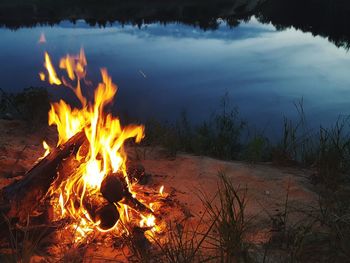 Close-up of bonfire against sky at night