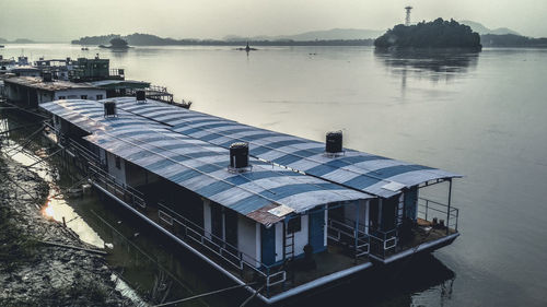 High angle view of ship moored in lake against sky