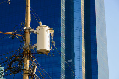 Electric utility distribution transformers that are mounted on an electrical service pole