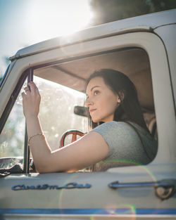 Portrait of woman sitting in car