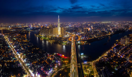 Aerial view of city lit up at night