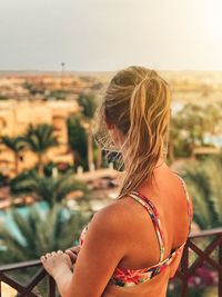 Rear view of woman looking away