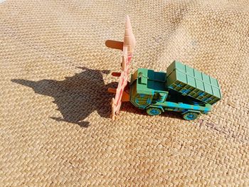 High angle view of toy on sand