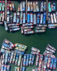 Stack of multi colored boats in canal