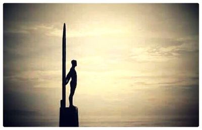 Man on sea at sunset