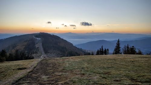 Scenic view of landscape against sky during sunset