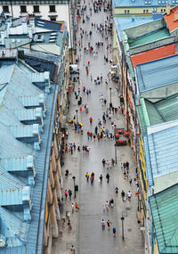 High angle view of people walking on street in city