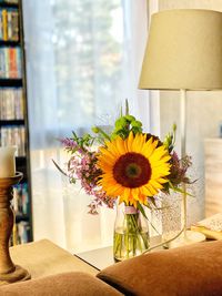 Flower vase on table at home