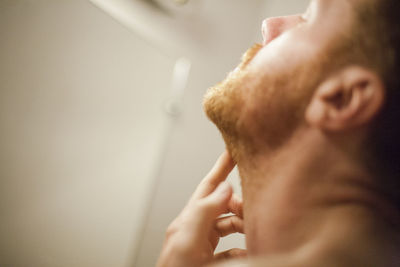 Close-up of man hand on wall