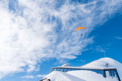 A paraglider on sky in diablerets glacier at 3000 meters above sea level in switzerland 