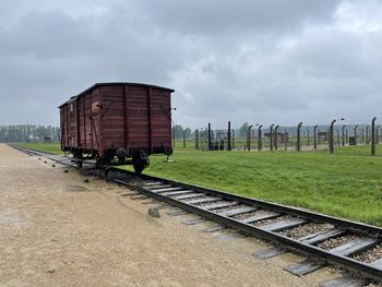 Train on railroad track against sky