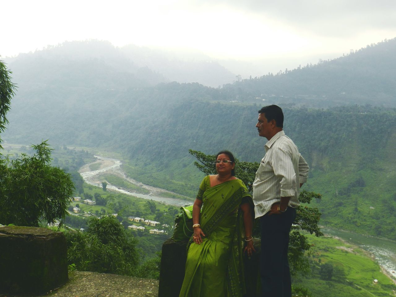 REAR VIEW OF MEN ON MOUNTAINS