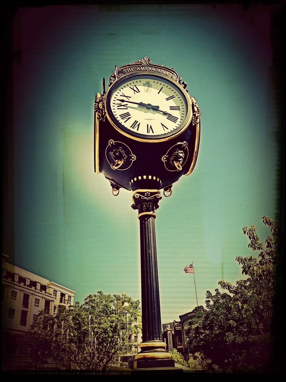 clock, transfer print, time, low angle view, text, auto post production filter, communication, number, clock tower, clock face, western script, old-fashioned, built structure, clear sky, circle, no people, day, roman numeral, architecture, sky