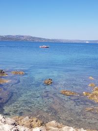 Scenic view of sea against clear sky