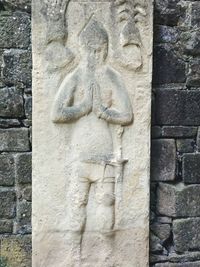 Close-up of statue against wall