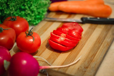 High angle view of tomatoes on cutting board