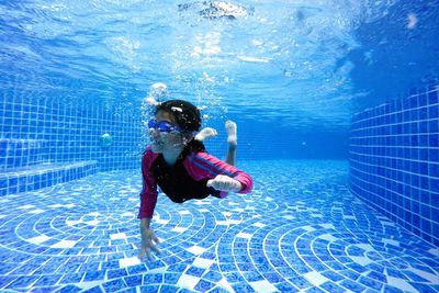 Girl swimming in pool