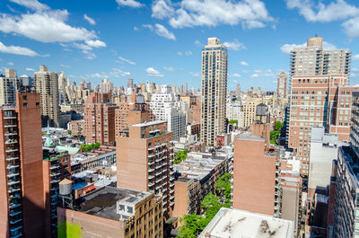 High angle view of buildings in city against sky