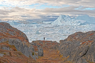 Looking at the icefjord from barren rocks along the icefjord of ilulissat, greenland