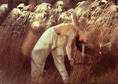  woman dancing in a field 