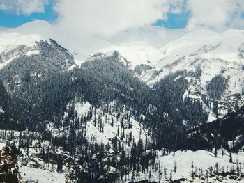 Scenic view of snow covered mountains