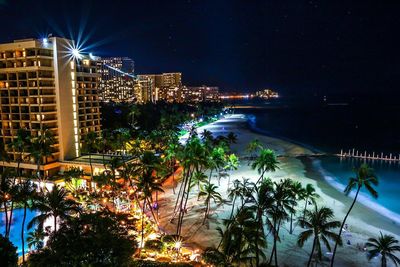 View of city lit up at night