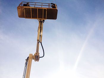 Low angle view of street light against blue sky