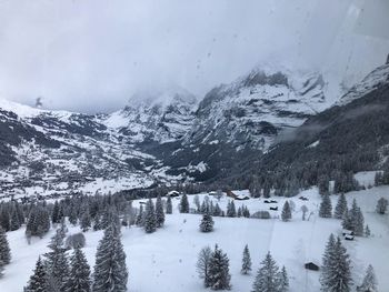 Scenic view of snow covered land and mountains