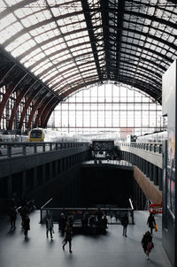 Antwerpen centraal train station - low angle view of trains, platform, passengers, and roof