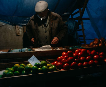 Portrait of man holding apples