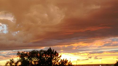 Low angle view of cloudy sky at sunset