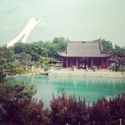 View of temple building by lake